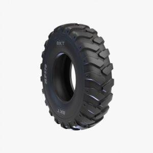 MP 570 heavy-duty tire on a backhoe loader in rugged conditions.
