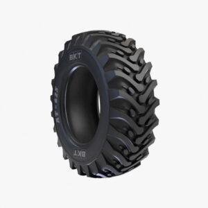 AT 625 heavy-duty tires on a backhoe loader in a sugarcane field.