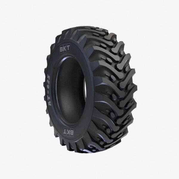 AT 625 heavy-duty tires on a backhoe loader in a sugarcane field.
